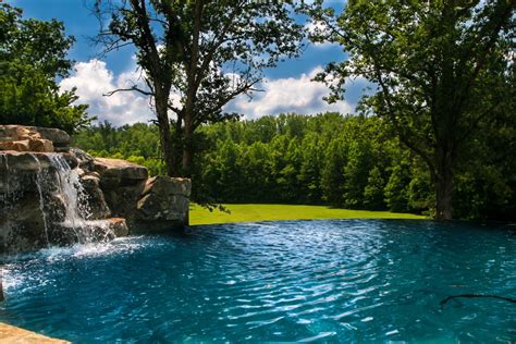 Negative Edge Pool With Waterfall And Natural Spa Traditional Pool