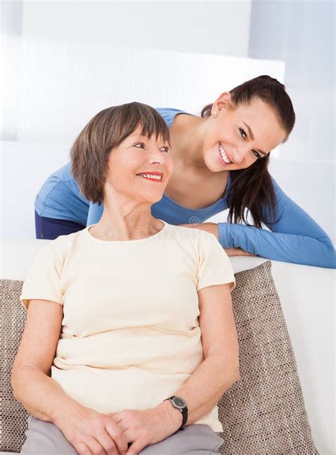 Portrait Of Happy Caregiver With Senior Woman Stock Photo Image Of