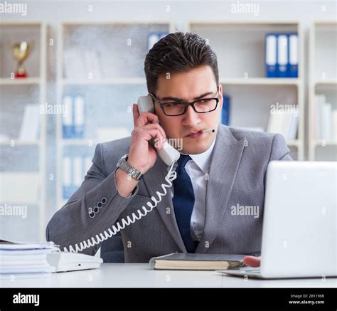 The Businessman Smoking In Office At Work Stock Photo Alamy