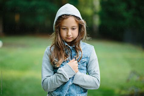 Portrait Of A Cute Young Girl In A Hooded Denim Jacket Del