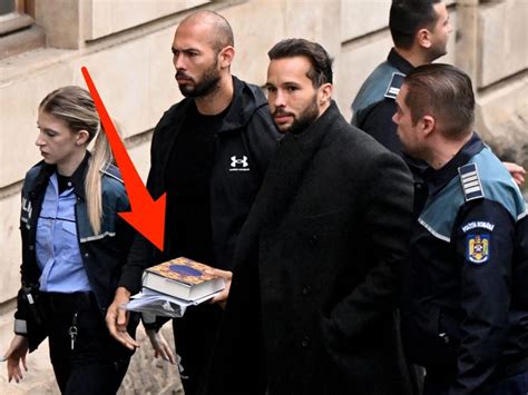 Photo Andrew Tate In Handcuffs Carries Quran On His Way To Court