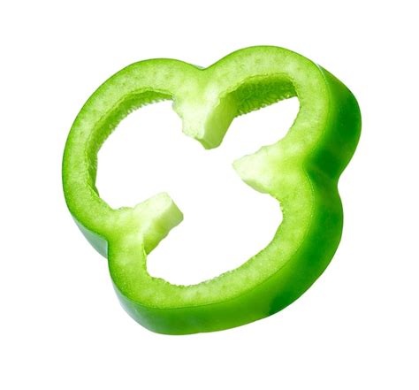 Premium Photo Sliced Green Pepper On White