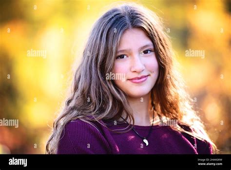 Beautiful Happy Tween Girl Outdoors In Fall Colors Stock Photo Alamy
