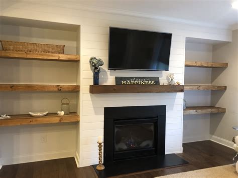 Shiplap Wall With Floating Shelves And New Mantle Around Fireplace