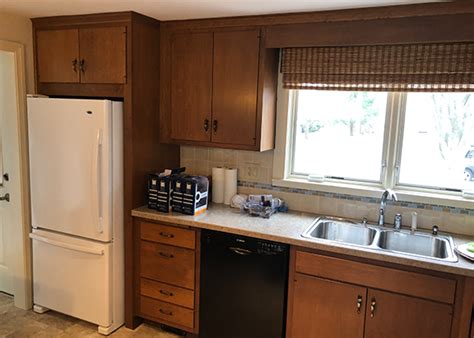 Cabinet ends and bottoms were installed first so that the hardwood facing would cover the plywood edge. Heartwood Cabinet Refacing - Photo Gallery