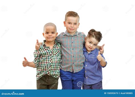Three Boys Are Standing Together On The White Background And Hold Their