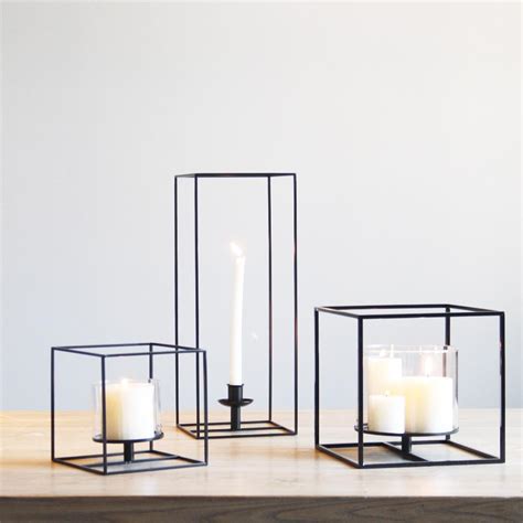 Brighten tabletops and wall shelves with a smattering of delicate tea light holders. Black Metal Tea Light Candle Holders | Candle holders ...