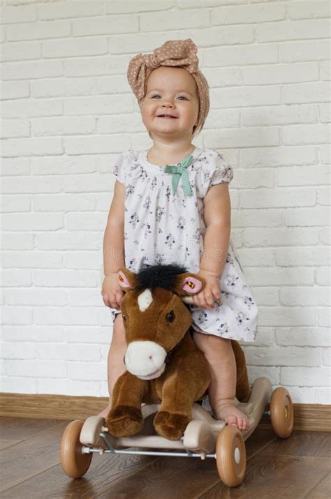 Adorable Baby Girl Riding Toy Horse Kid Play Indoor Baby Rocking
