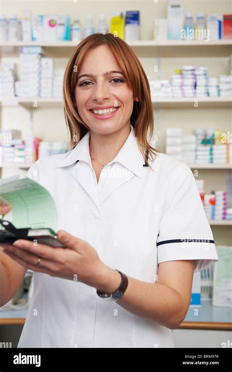 Pharmacist Looking At Prescriptions Stock Photo Alamy