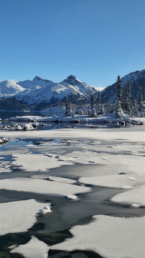 Download Wallpaper 800x1420 Lake Mountains Ice Snow Winter