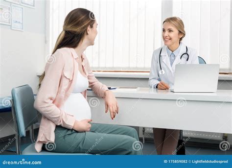 Pregnant Woman Having Consultation With Doctor Stock Photo Image Of