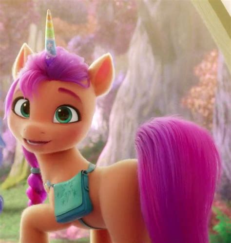 An Animated Pony With Pink Hair And Blue Eyes Standing Next To Another