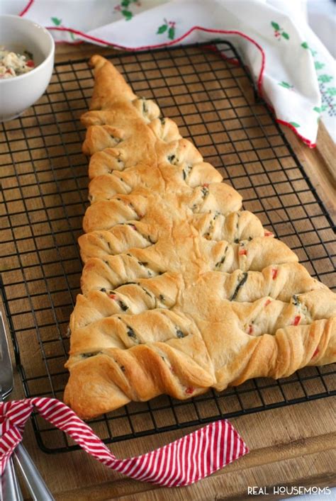 Using a pizza cutter or knife, cut from a bottom corner to the center of the top. Spinach Dip Stuffed Crescent Roll Christmas Tree ⋆ Real Housemoms