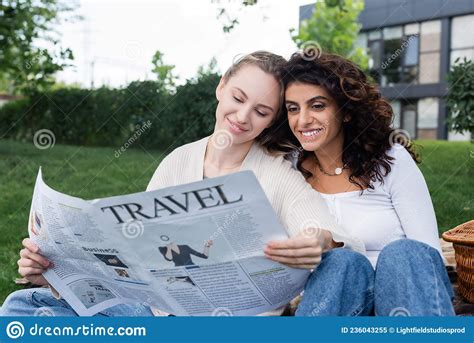 Joyful Lesbian Couple Reading Travel Newspaper Stock Image Image Of Checkered Gender 236043255