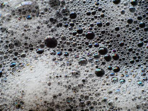 Bubbles Of Foam On Water Close Up Textured Cleaning Shampoo Bubble