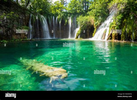 Long Exposure Waterfalls Splashing Into Pond Plitvice Lakes National
