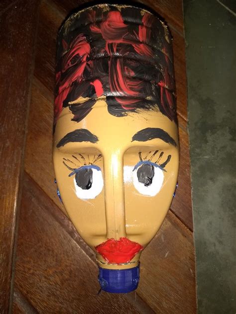 A Plastic Mask With Eyes And Nose Painted On It S Face Sitting On A Wooden Floor