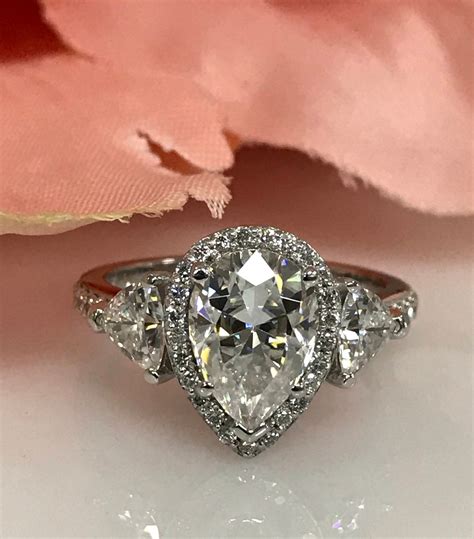 Certified Moissanite Pear Shape With Trillion Round Diamond Accents