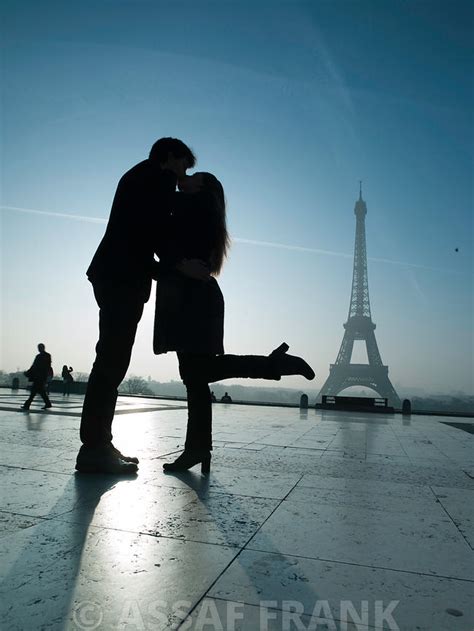 Assaf Frank Photography Licensing Couple Kissing In Front Of Eiffel