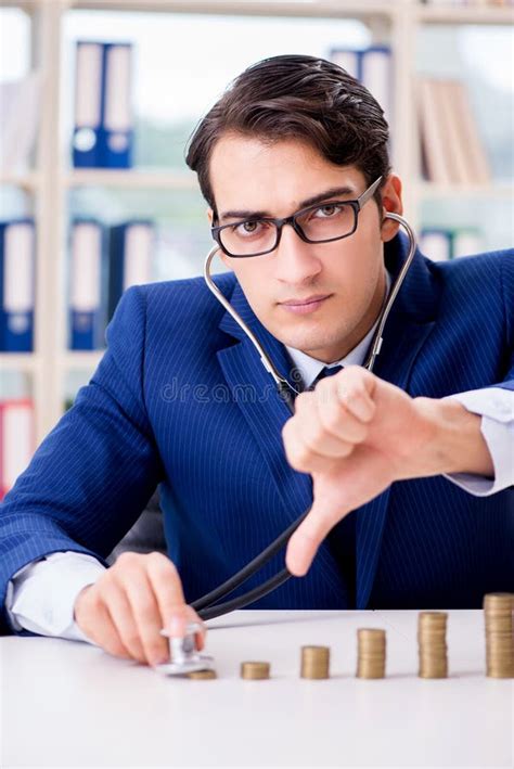 The Businessman With Stacks Of Coins In The Office Stock Image Image