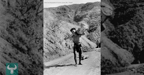 notice that the man is carrying a log and pulling a log behind him with a rope luzon