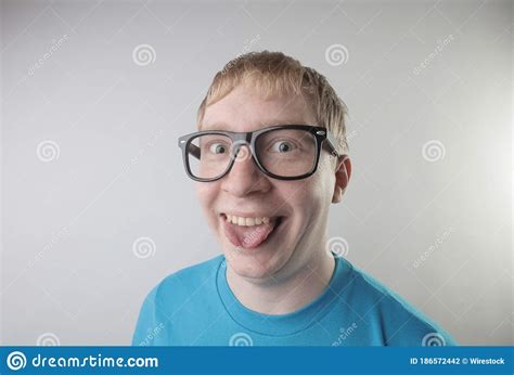 Closeup View Of A Caucasian Male Wearing A Blue T Shirt And Eyeglasses
