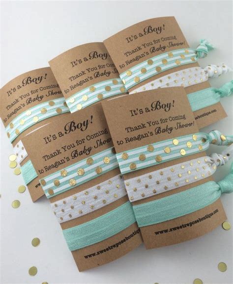 Baby shower favors are not necessary but often the hostess follows the tradition of giving small gifts to the guests. Baby boy shower favors, baby boy shower, hair tie favors ...