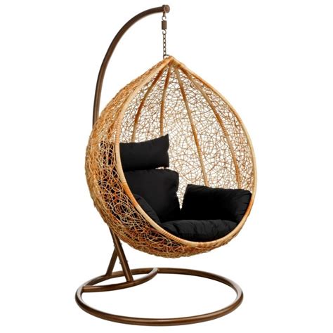 The spot is paired with a hanging swing chair with a seat made out of black wicker weave. Hanging Egg Chair & Wicker Ceiling Chair Hang in Retro Style