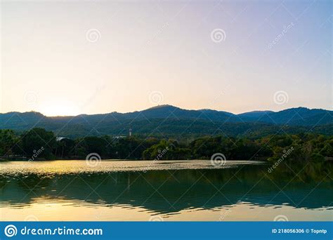 Ang Kaew Lake At Chiang Mai University With Forested Mountain Stock