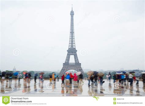 Eiffel Tower In Paris With Tourists And Rain Stock Photo Image Of