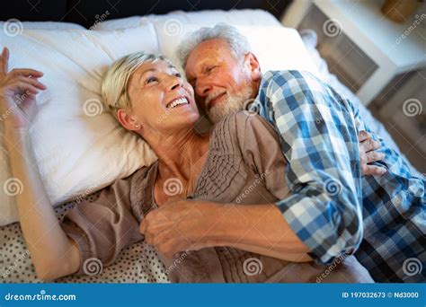 Happy Senior Couple In Love Hugging And Bonding With True Emotions At