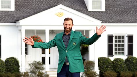Dustin Johnson Dons His Green Jacket After Winning The 2020 Masters At