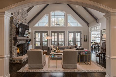 There's no better way to make a space feel bigger and brighter than vaulted ceilings. great room vaulted ceiling with beams and windows ...