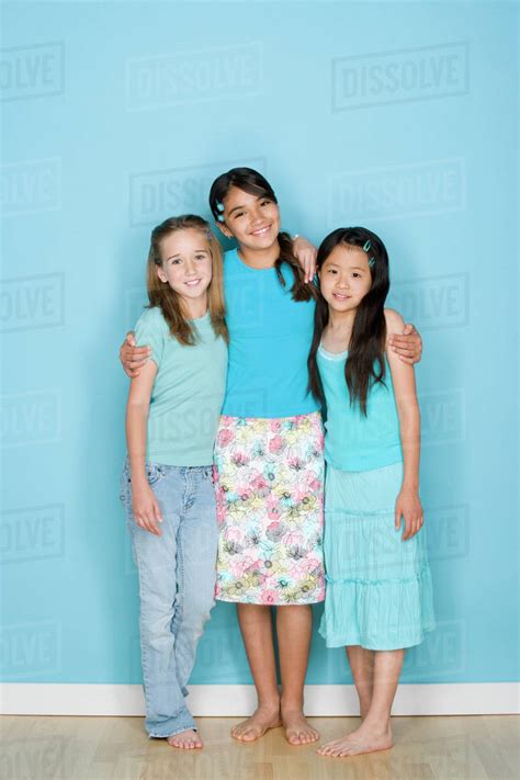 Studio Shot Portrait Of Three Teenage Girls Full Length Stock Photo