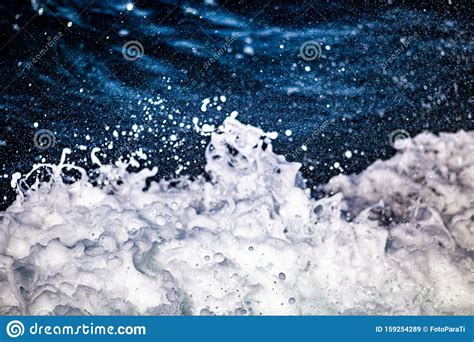 A Close Up Shot Of Seafoam In The Rough Blue Waters Stock Image Image