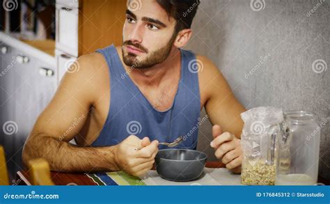 Attractive Young Man Eating Breakfast Stock Photo Image Of Happy
