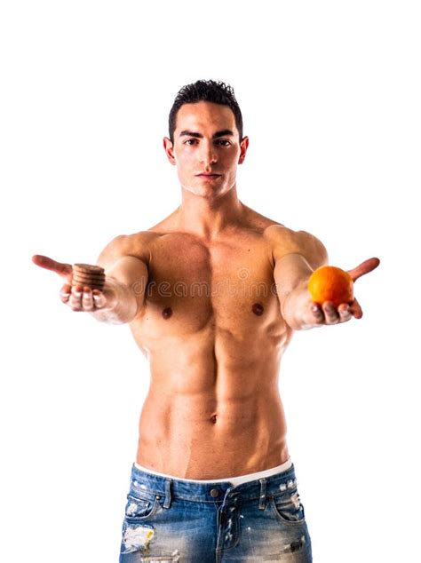 Muscular Shirtless Man Deciding Between Healthy Fruit And Unhealthy