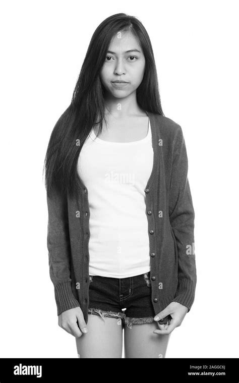 Studio Shot Of Young Asian Teenage Girl Standing Stock Photo Alamy