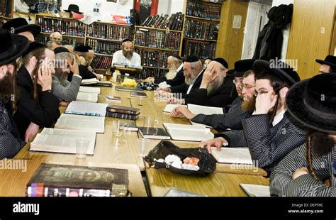 A Group Of Orthodox Jews Study The Torah With Their Rabi Teacher