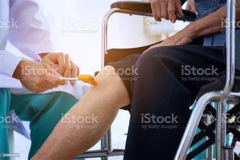 Doctor Checks The Patients Reflexes Neurologist Hammer For Knocking