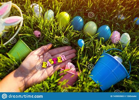 This set of easter writing prompts focuses on some of the basics of the religious and here are 10 easter writing prompts you can use to ring in the holiday with your classroom or your own personal. Happy Easter. Easter Eggs Hidden In Spring Grass. Writing Made Of Wooden Letters In Hand Stock ...