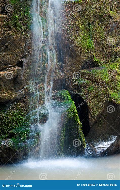 Close Up Of Waterfall Cascade Over The Mossy Rock Stock Image Image