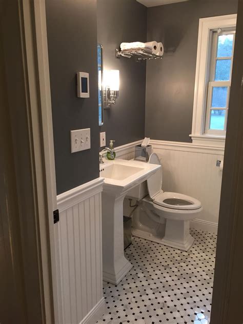 This bathroom features the same 3/5 wainscoting height as the previous example. 25 Beautiful Gray Bathrooms