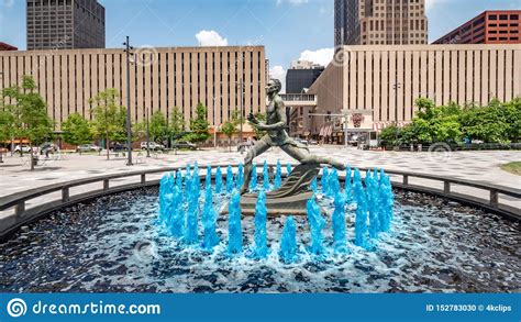 Blue Water Fountain With Runner Statue At Kiener Plaza Park In St