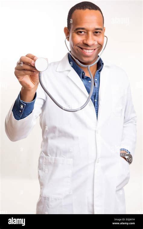 Handsome Young African Doctor Posing Isolated Over A White Background