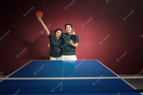 Premium Photo Couples Of Young People Playing Ping Pong With Ping Pong Paddles Having Fun