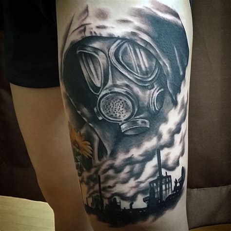 Black And Gray Style Creepy Looking Thigh Tattoo Of Man In Gas Mask And