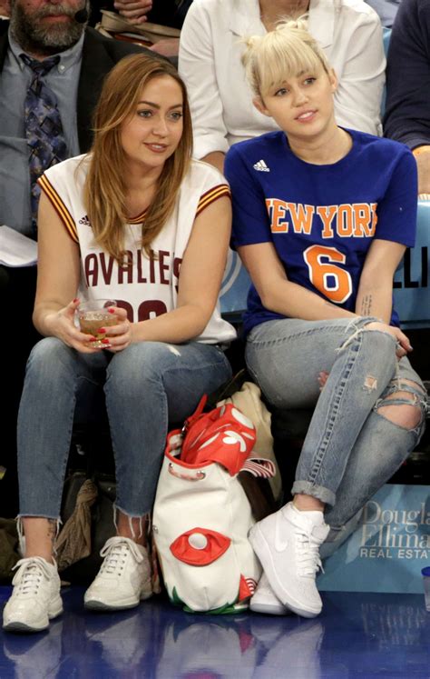 miley cyrus with sister brandi at the knicks game 05 gotceleb