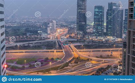 Aerial View Of A Road Intersection In A Big City Day To Night Stock