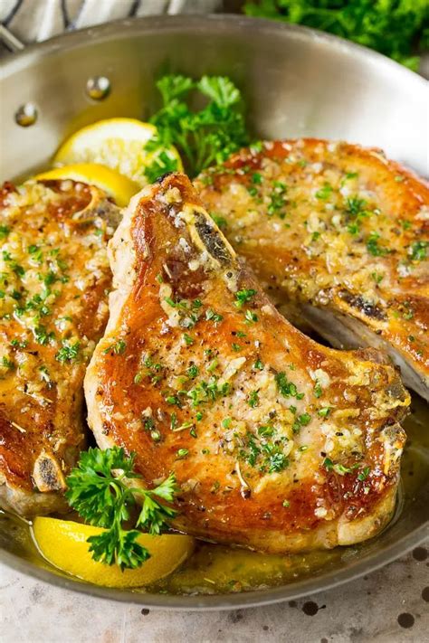 These Baked Pork Chops Are Coated In Garlic And Herb Butter Then Oven Roasted To Golden Brown